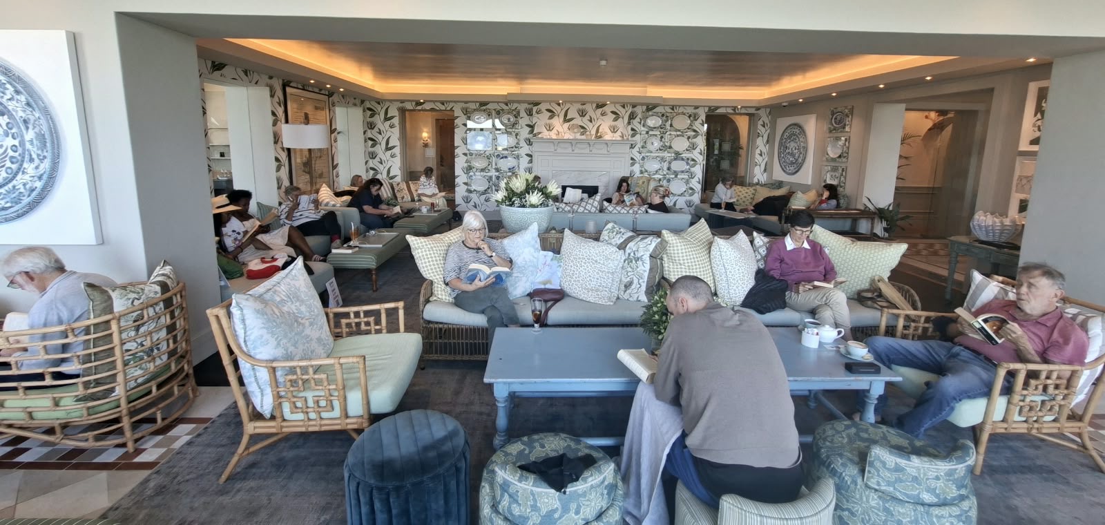 Readers enjoying a Silent Reading gathering in a comfortable lounge